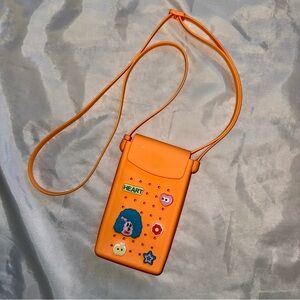 Silicone Neon Orange Crossbody Bag w/Cute Charms for carrying Phone